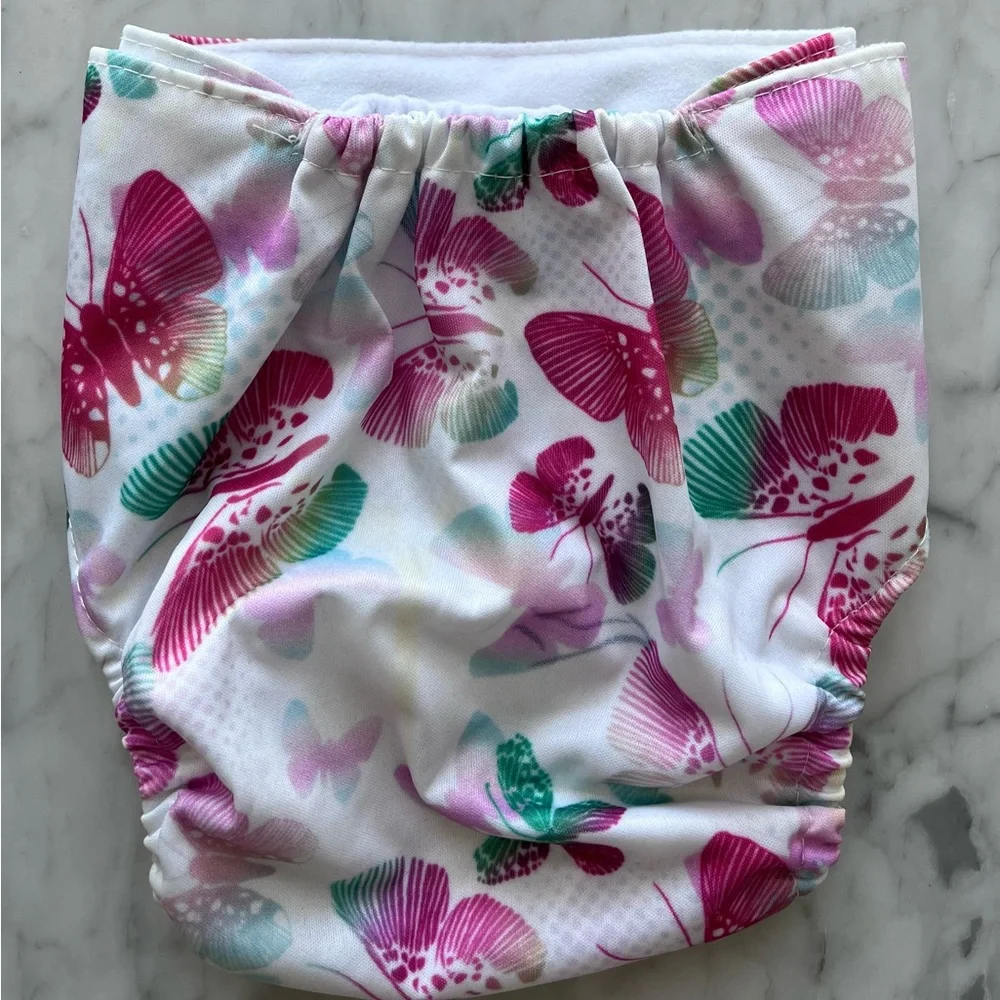 Adjustable, vinyl, disposable diapers with carry bag. Inserts bought separately.